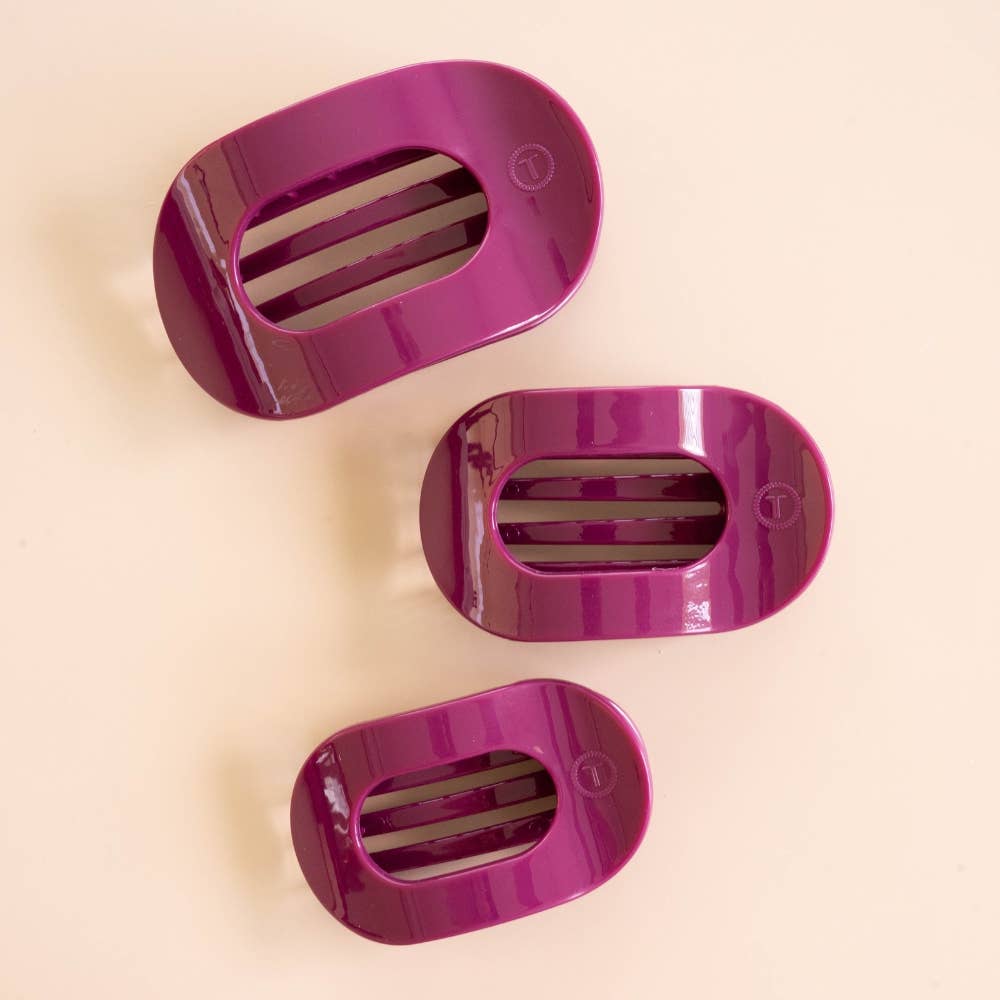 Mulberry Medium Flat Round Hair Clip in shiny, oval-shaped purple design with horizontal slits. Available in multiple sizes.