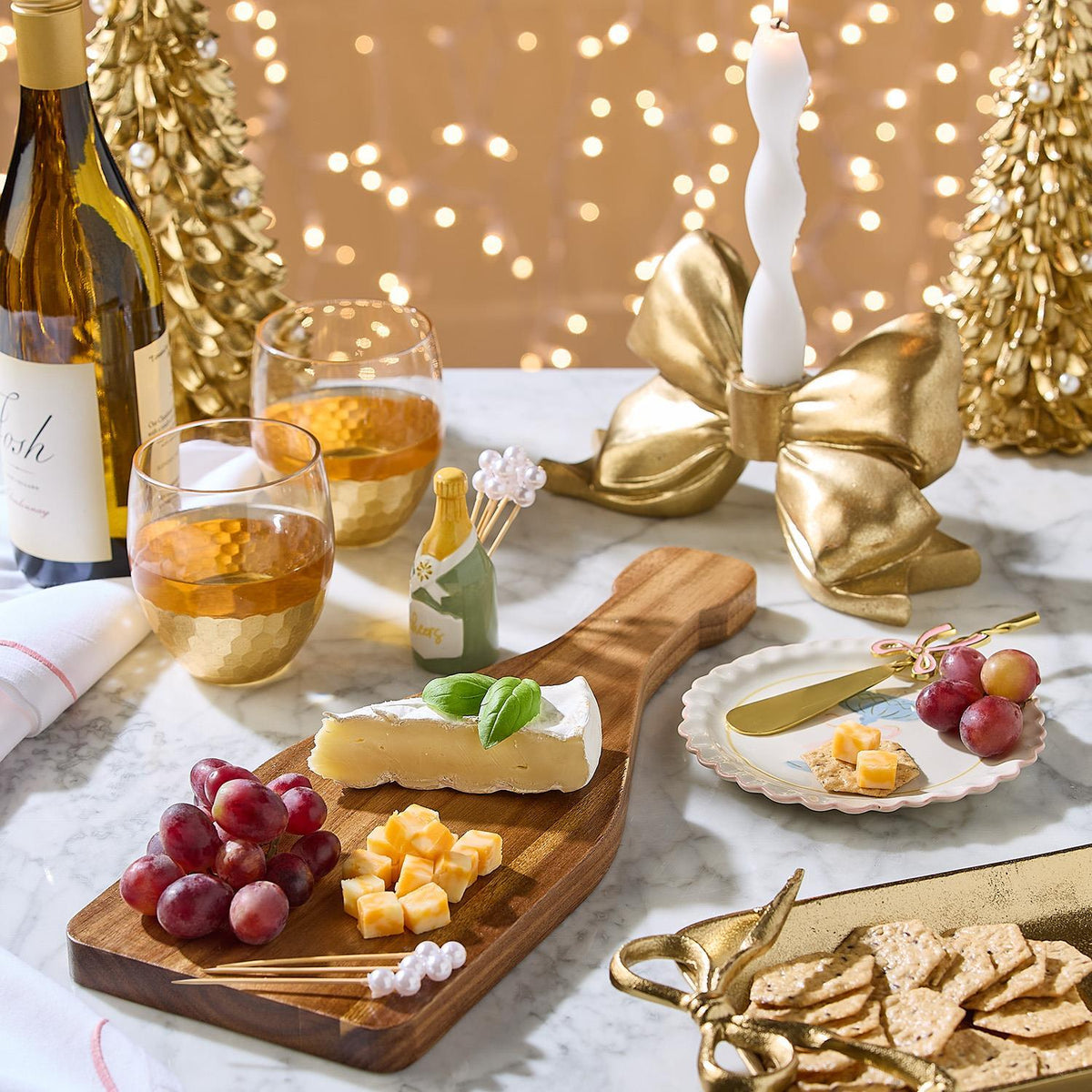 Champagne Toast Charcuterie Board displayed on elegant acacia wood, available in small (12″x8″), medium (16″x10″), and large (20″x12″) sizes.