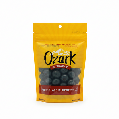 Yellow resealable pouch labeled "Chocolate Blueberries" with a clear window showing chocolate-covered blueberries made from dried blueberries; certified kosher. Sizes available: [insert sizes if known].