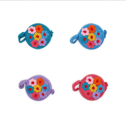 Floribunda hand-crocheted round measuring tapes in teal, blue, lavender, and pink with flower patterns; available in one size.