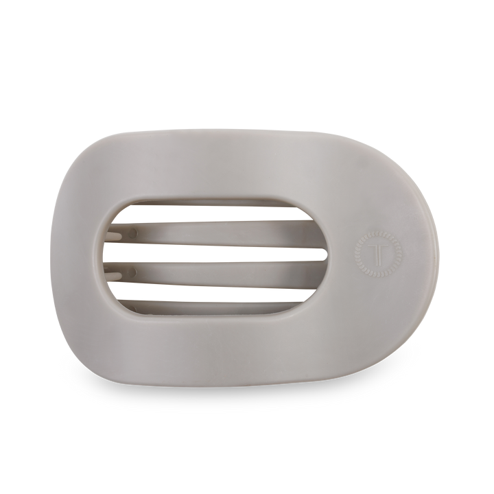 White oval soap dish with three drainage slats and a small circular logo on the right. Sizes available: small, large.
