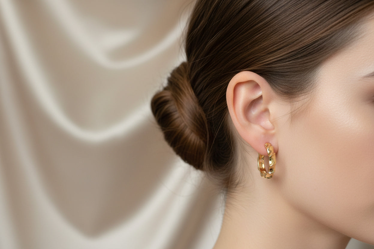 Elegant gold hoop earrings; available in small, medium, and large sizes.