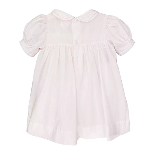 Light pink baby dress with pintucks, featherstitching, short sleeves, Peter Pan collar. Sizes: NB-24M.