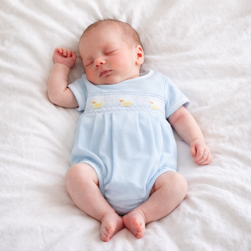 Little Ducklings Classics Smocked Bubble, Light Blue, hand-embroidered ducklings on chest. Available in newborn sizes.