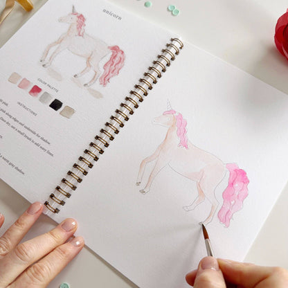 Spiral-bound Fairytale watercolor workbook with unicorn illustration and color palette guide; available in multiple sizes.