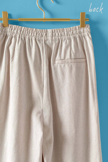 Natural Linen Blend Wide Leg Drawstring Pants with elastic waistband, single back pocket. Available in sizes XS-XL.