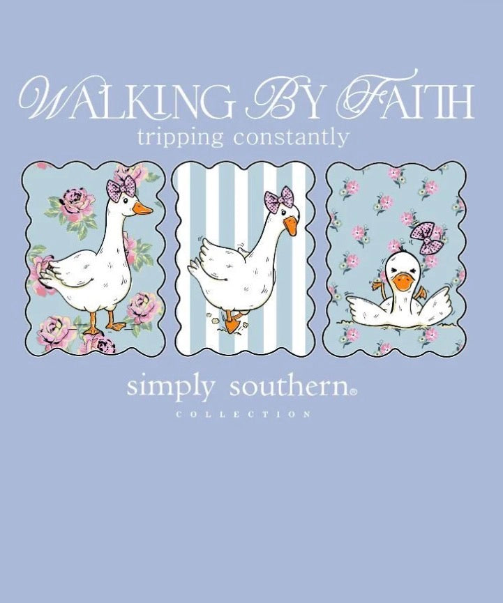 Walking By Faith Tripping Constantly T-Shirt features three cartoon ducks with pink bows in floral and striped frames above the words “WALKING BY FAITH tripping constantly” and “simply southern collection.” Available in sizes S-XXL.