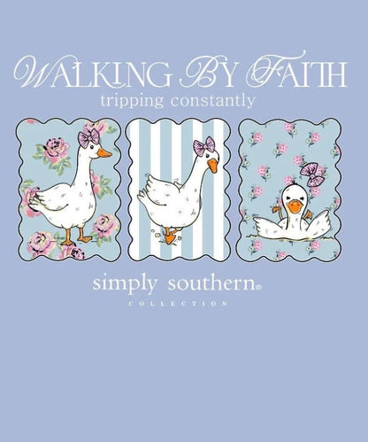 Walking By Faith Tripping Constantly T-Shirt features three cartoon ducks with pink bows in floral and striped frames above the words “WALKING BY FAITH tripping constantly” and “simply southern collection.” Available in sizes S-XXL.