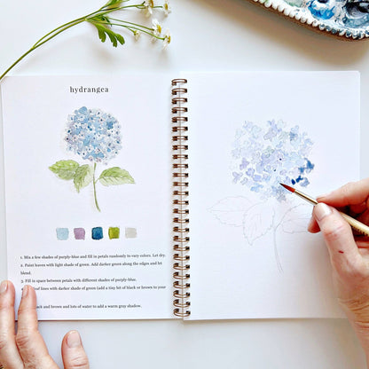 Flowers Watercolor Workbook in spiral format, includes step guides, swatches, and art; available in standard 8x10 inch size.