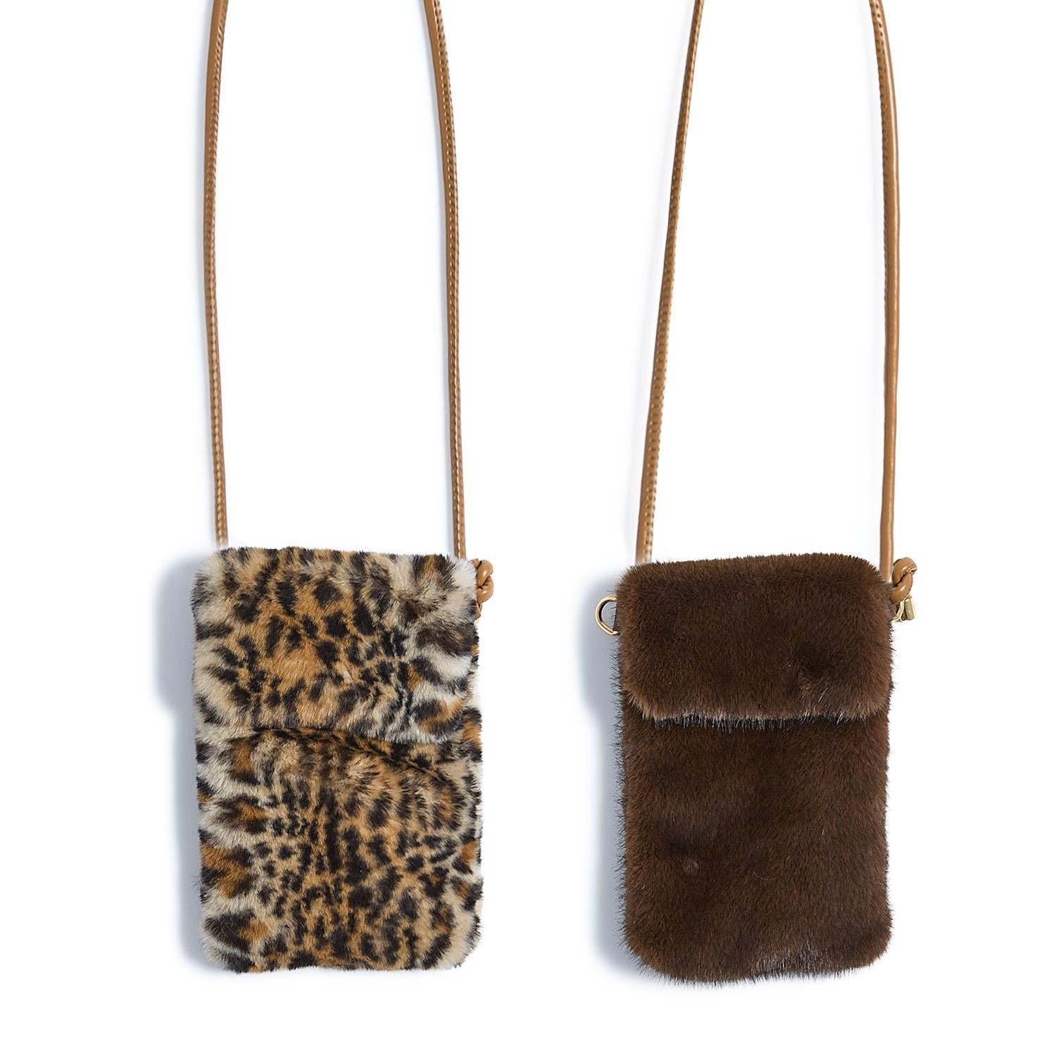 Small faux fur crossbody bags with tan straps, available in leopard print or solid brown; compact, hands-free design. Sizes available: mini.