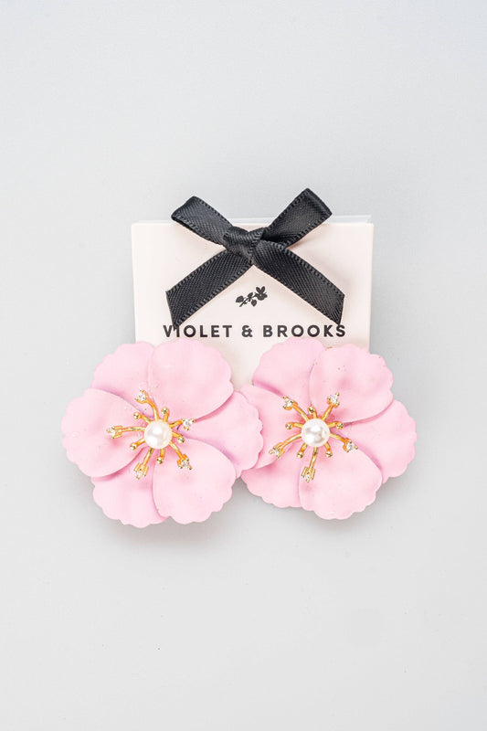 Pink flower-shaped statement earrings with gold-plated accents, pearl center. Available sizes: one size fits all.