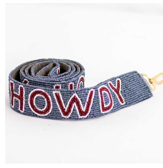 The Howdy Beaded Purse Strap is a 44-inch blue beaded strap featuring "HOWDY" in white and red letters, with a gold clasp for easy attachment.