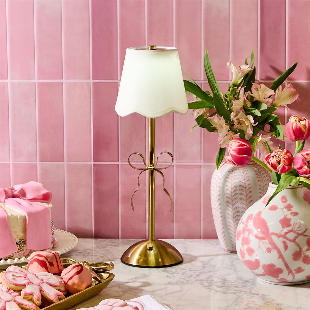 LED Cordless Gold Bow Table Lamp with white shade, available in small and large sizes.