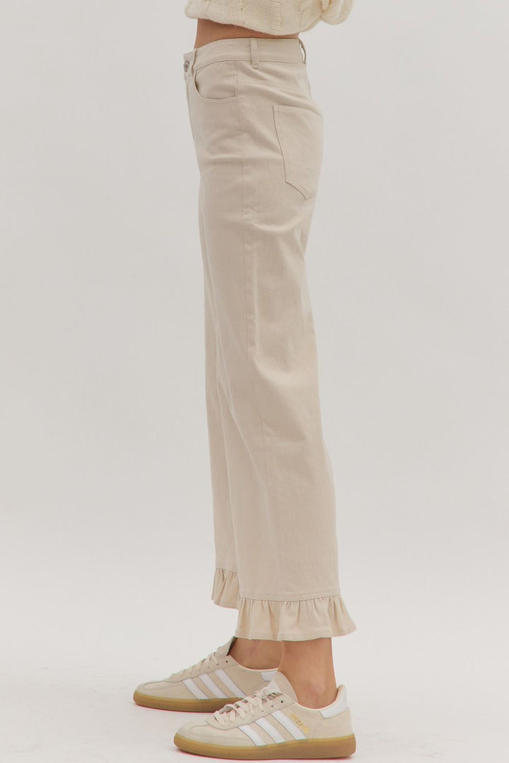 Leah Ruffle Trim Pants in light beige with subtle ruffle detail, available in sizes XS-XL.