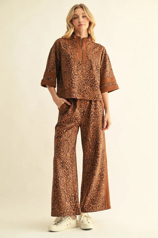 Leopard Contrast Pants with brown leopard print, side stripes, and a drawstring waist. Available in sizes XS–XL.