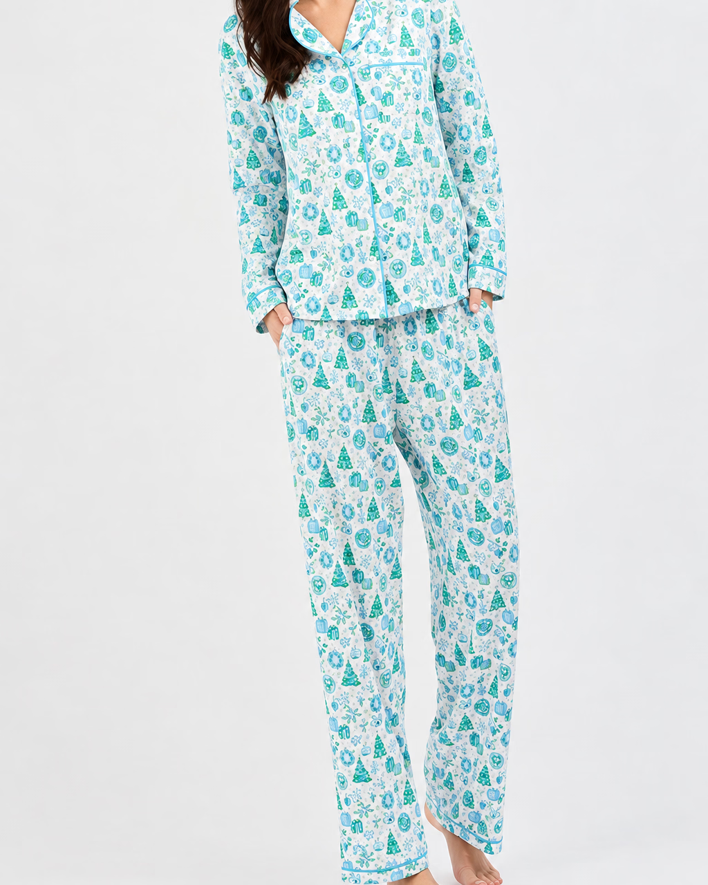 Charlotte Whimsey Wishes button-down pajama shirt and pants set with green Christmas tree and blue holiday icon print. Available in multiple sizes.