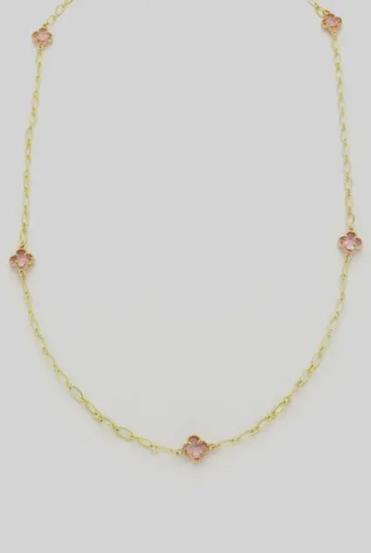 Delicate gold chain with three small pink clover-shaped stones. Available sizes: 16", 18", 20".