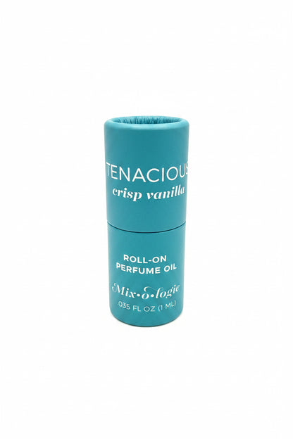 Teal cylindrical Keychain Mini Rollerball Perfume labeled “TENACIOUS crisp vanilla,” 0.35 FL OZ/11 mL, long-lasting scent.