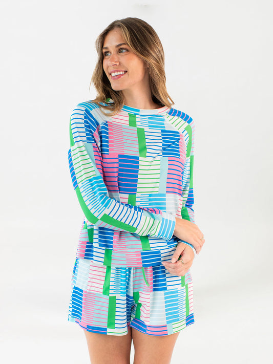 Annie Shorts Set with relaxed fit, vibrant blue, green, pink, and white geometric pattern. Available in sizes XS-XL.