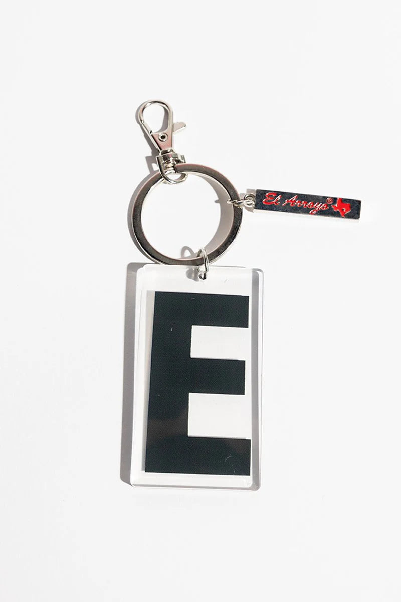 Large black "E" in clear acrylic frame on metal key ring with small tag; sizes available: standard.