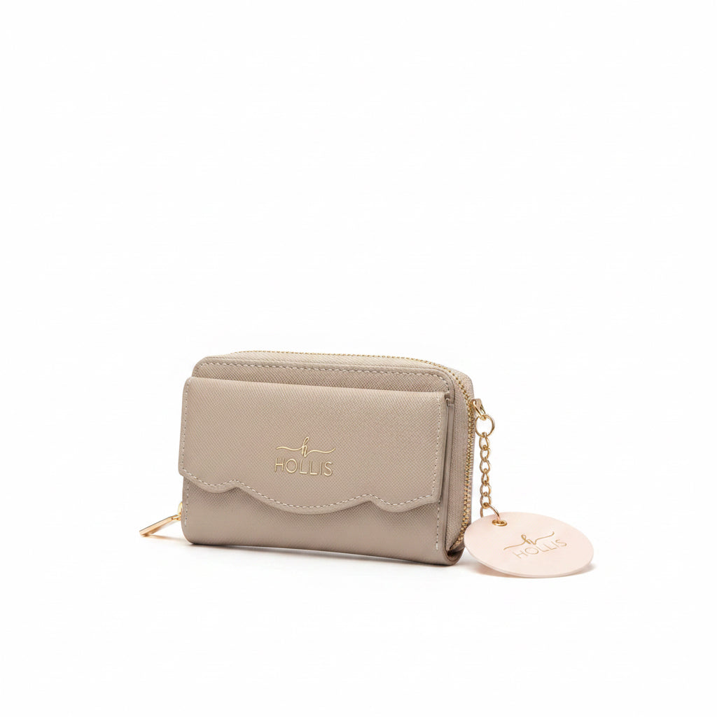 Beige Hollis Scalloped Cardholder with scalloped flap, gold key ring, and round tag. Sizes available: S, M, L.
