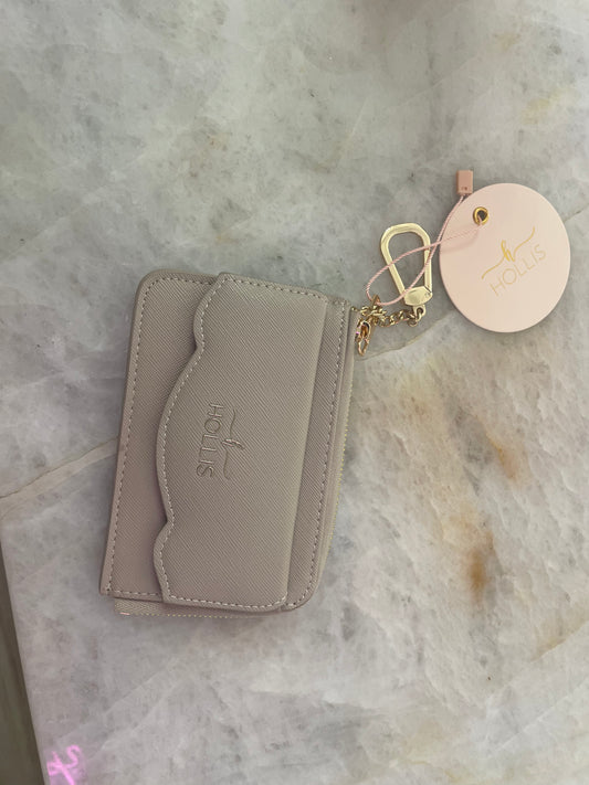 Beige Hollis Scalloped Cardholder with scalloped flap, gold key ring, and round tag. Sizes available: S, M, L.