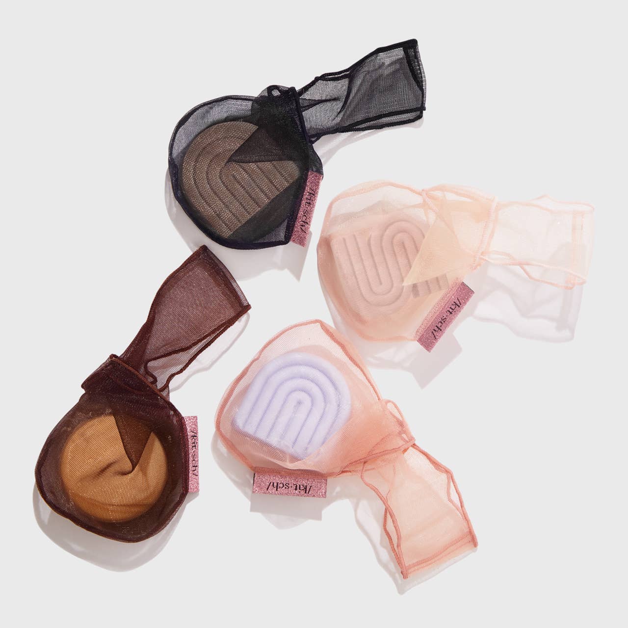 Four RPET Beauty Bar Conditioner Bags in terracotta shades, mesh design, available in small and large sizes.