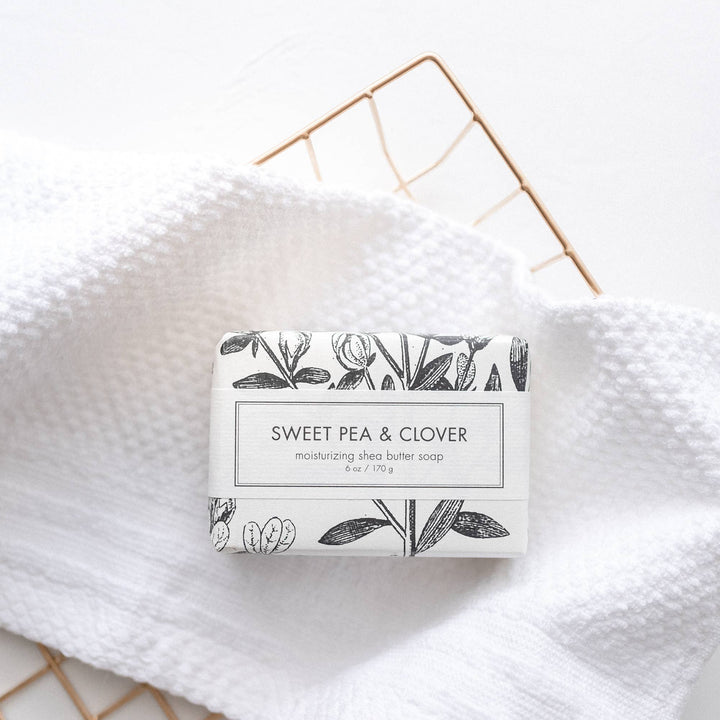 Sweet Pea &amp; Clover Soap is an elegant bath bar. Notably, the packaging design features botanical illustrations. This soap is available in a standard size offering.