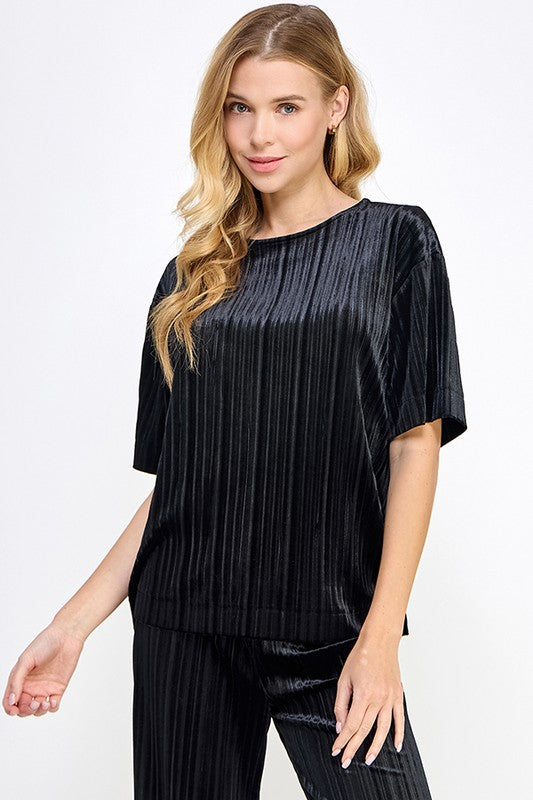 Pleated Velvet Set: shiny black blouse with vertical pleats and matching pants. Available in sizes XS-XL.