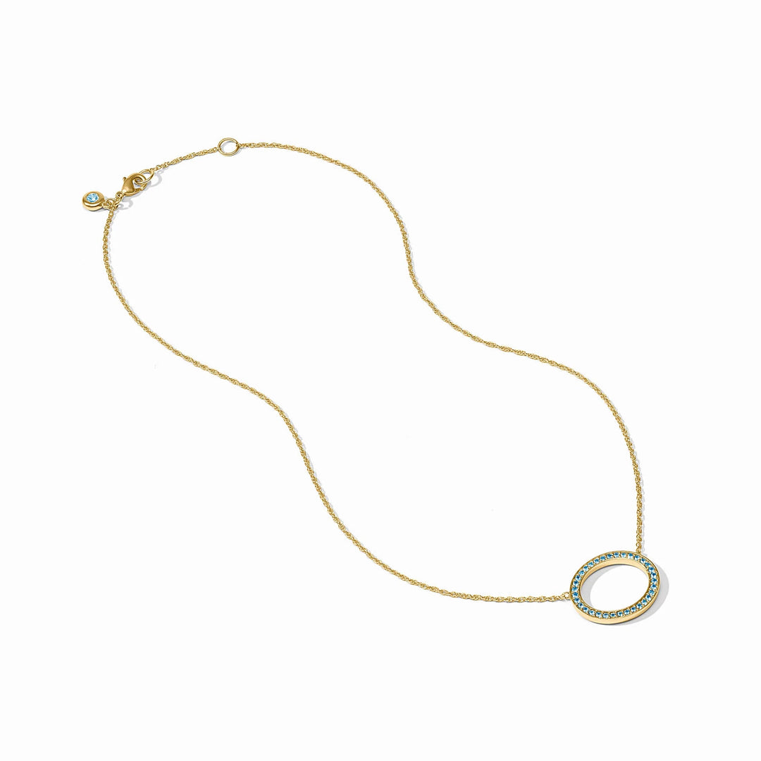 Stardust Delicate Necklace: 24K gold-plated chain with an oval blue CZ pendant and matching clasp stone.