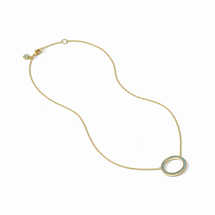 Stardust Delicate Necklace: 24K gold-plated chain with an oval blue CZ pendant and matching clasp stone.