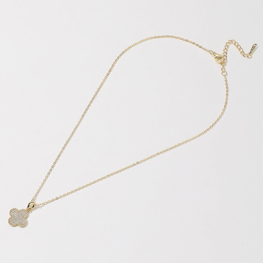 14K gold dipped quatrefoil pendant necklace with CZ stones; small clover design. Available in 16", 18", and 20" lengths.
