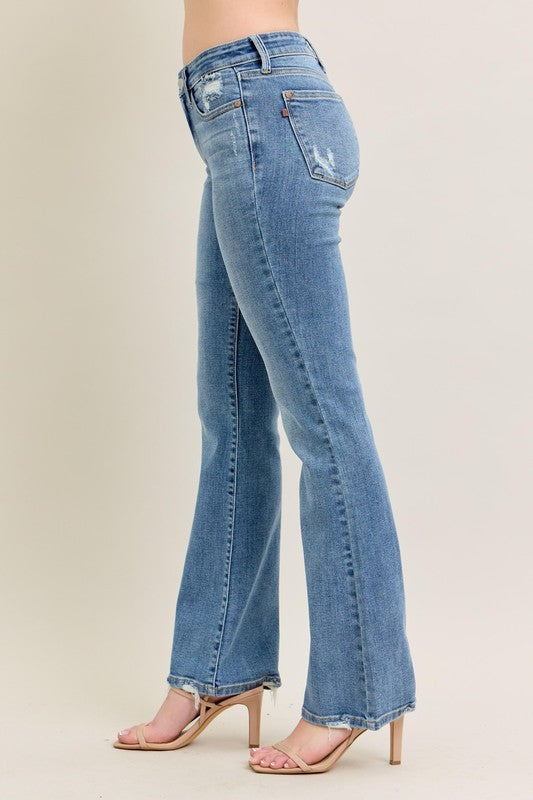 Judy Blue Vintage Wash Boot Cut Jeans with slight distressing, raw hems. Available in sizes 0-20.