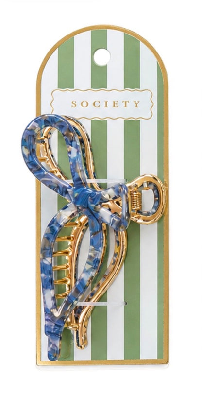 Blue and white marbled gold-tone metal bow claw clip with gold details. Available sizes: small, medium, large.