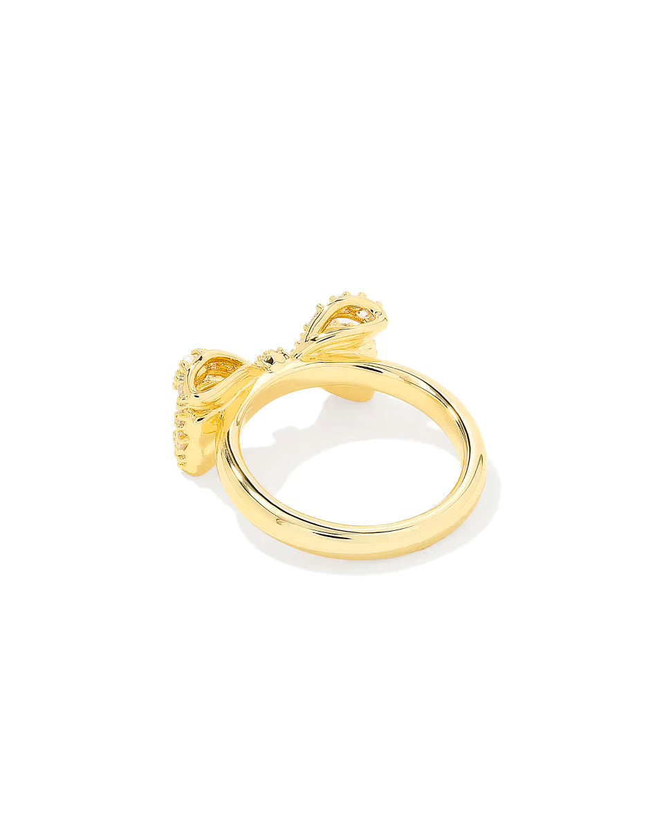 The Krista Bow Cocktail Ring by Kendra Scott features a gold bow design. Available in sizes 5-9.