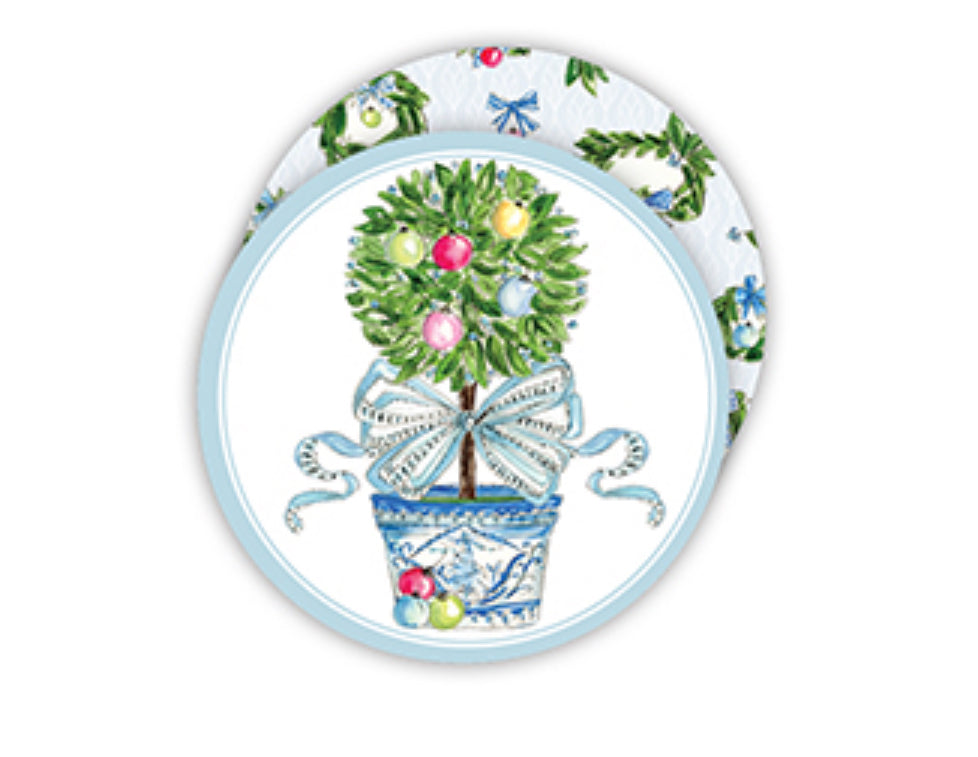 Small topiary tree with colorful ornaments in a decorative blue and white pot, tied with a ribbon. Set against a handpainted Round Coaster with a floral pattern. Perfect for cocktail coasters. Available sizes: small, medium, large.