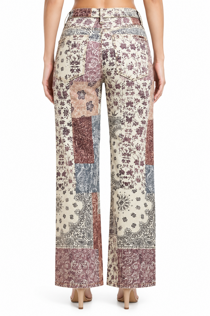 Risen High Rise Ankle Wide Jeans in a high-rise, wide-leg fit with a patchwork floral and paisley print. Available in multiple sizes.