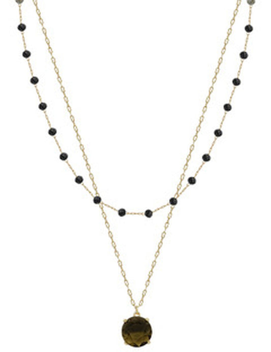 Double-chain necklace with small black beads on upper gold layer, bold black pendant on lower. Available in sizes S, M, L.