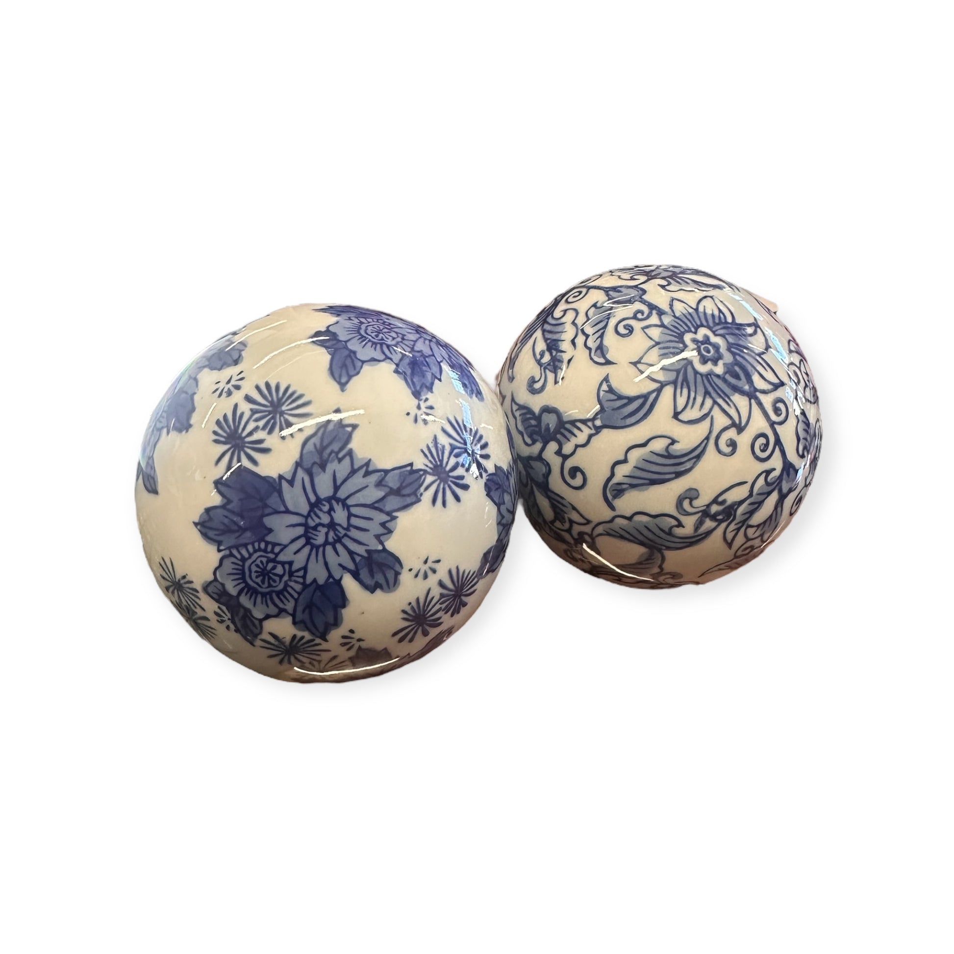 Two ornately decorated Ceramic Blue & White Decorative Balls featuring floral and botanical patterns. Sizes available: 4" and 6" diameter.