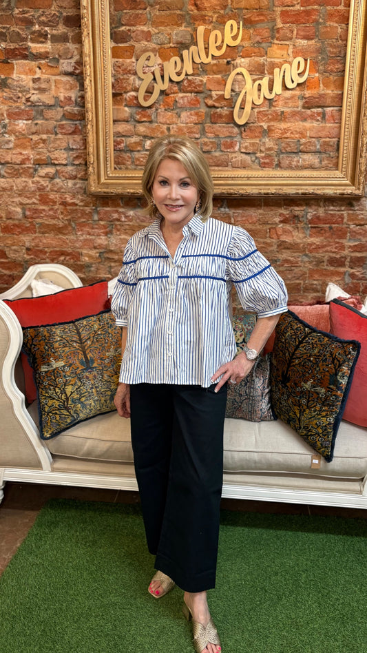 Gathered Piping Striped Blouse in two colors, available in sizes XS-XL. Features piped detail and gathered fit.