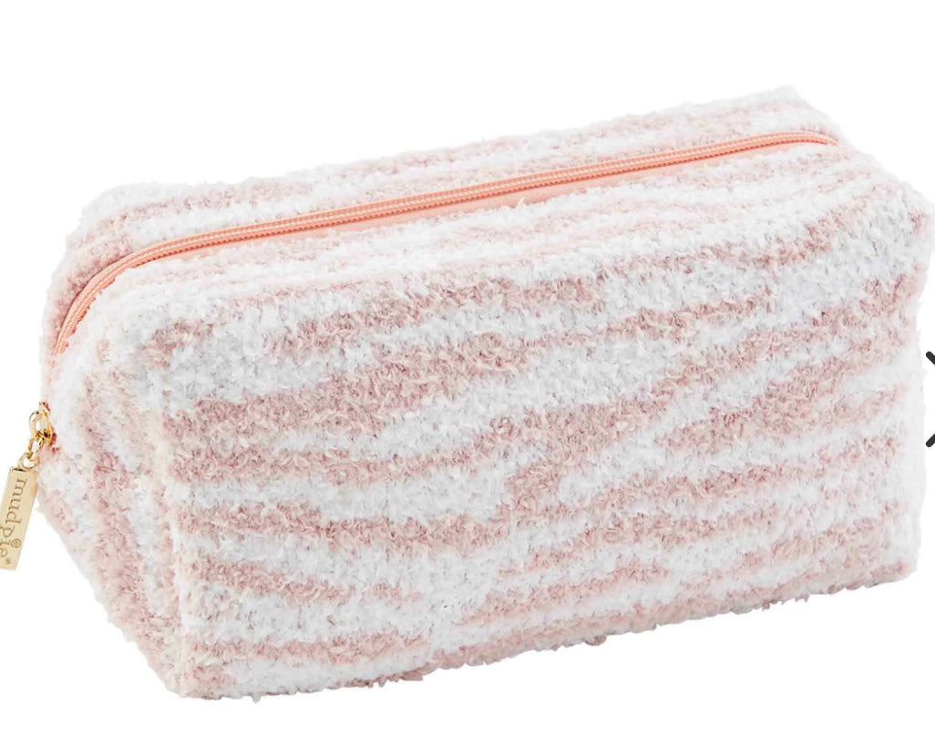 The product is a fluffy, striped Chenille Case in shades of pink and white. Features include a gold zipper pull with a branded tag. It presents a textured finish for an added touch of elegance. Ample space is provided due to its rectangular dimensions.