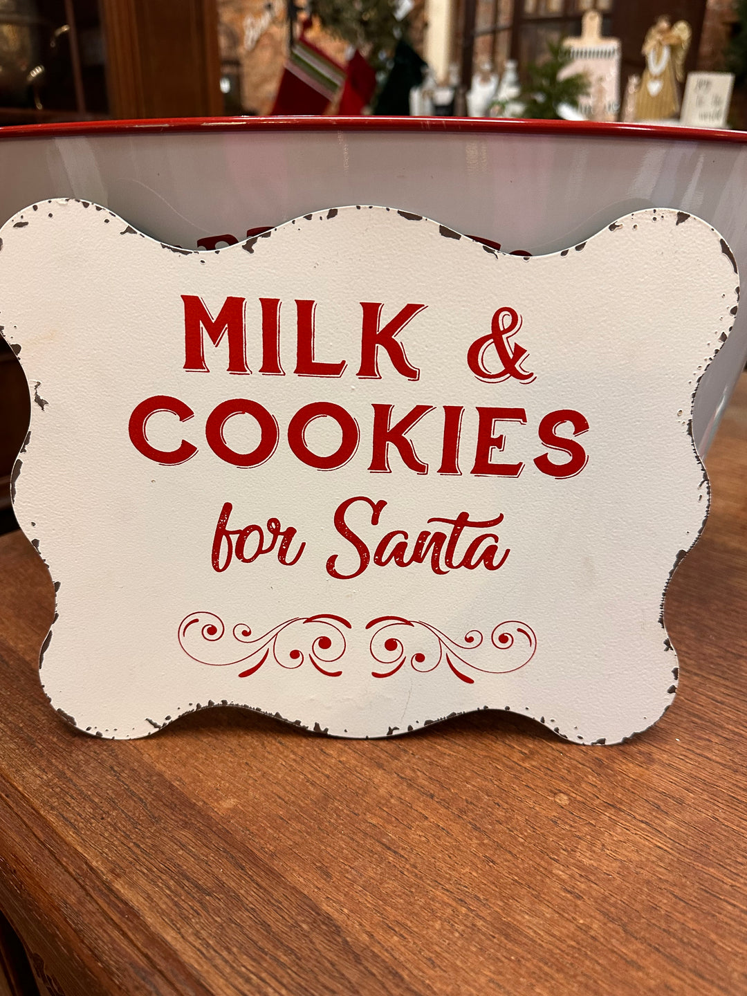10x8 white Santa metal sign with distressed edges, featuring red “Milk &amp; Cookies for Santa” text and a decorative flourish.