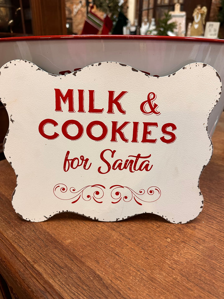 10x8 white Santa metal sign with distressed edges, featuring red “Milk &amp; Cookies for Santa” text and a decorative flourish.