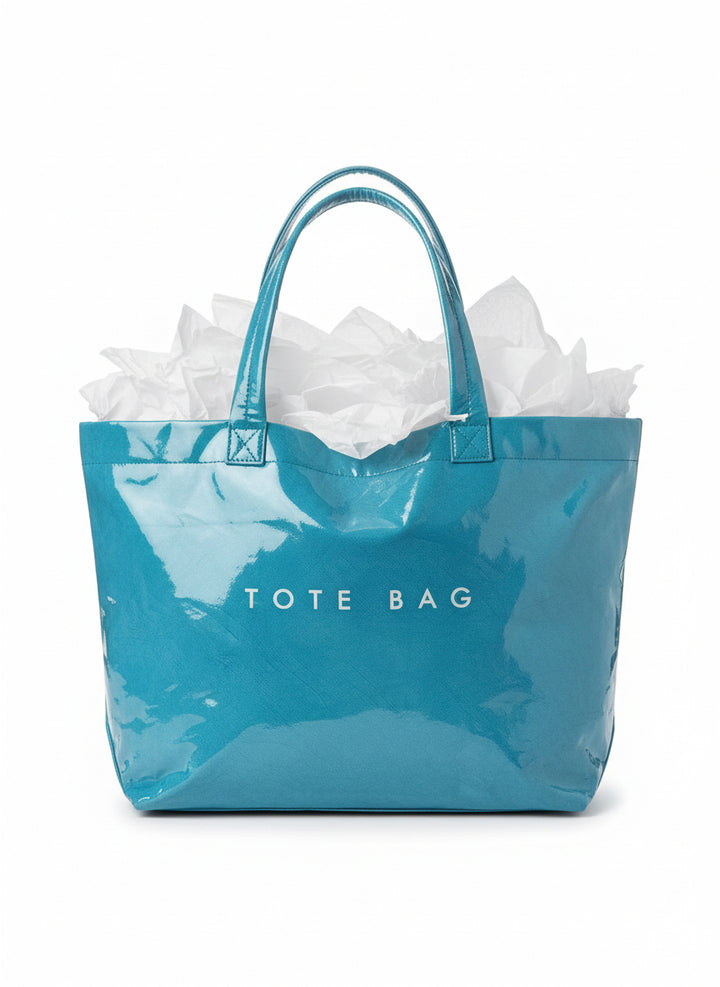 Shiny blue Vintage Tote Bag with two handles, "TOTE BAG" print, waterproof. Sizes: small, medium, large.