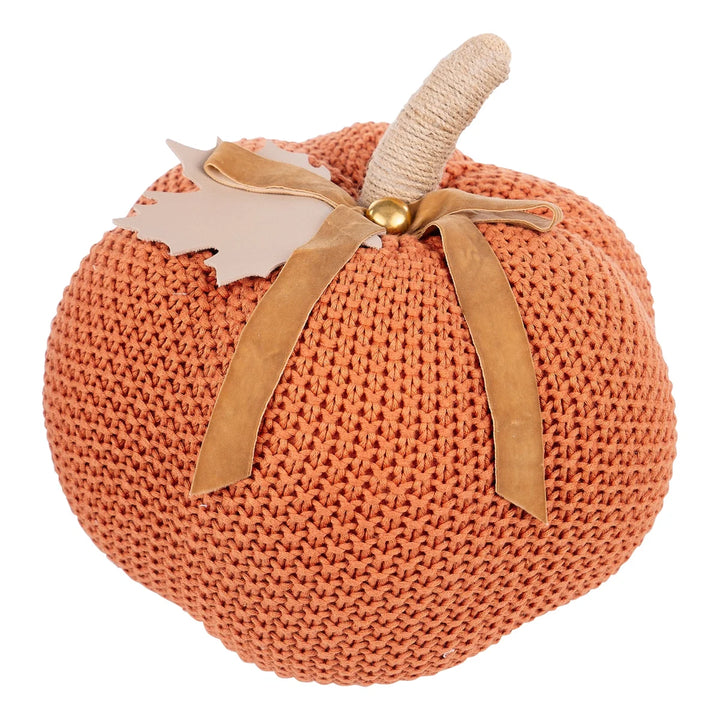 Burnt orange knit pumpkin with twine-wrapped stem, tan faux leather leaf, and matching bow; available in small, medium, and large sizes.
