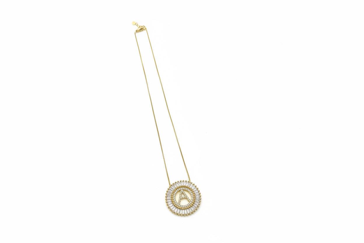 Crystal Initial Necklace: delicate chain, gold double-ring pendant with sparkling stones. Available in 16", 18", and 20" sizes.