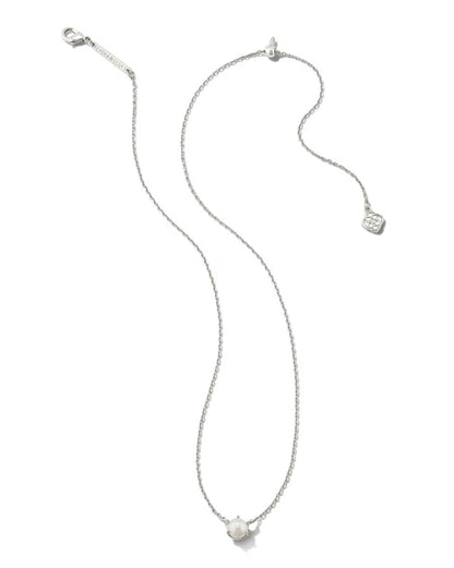 The Ashton Pearl Necklace by Kendra Scott: delicate silver chain, single round pearl pendant, small tag near clasp. Sizes: 16", 18".