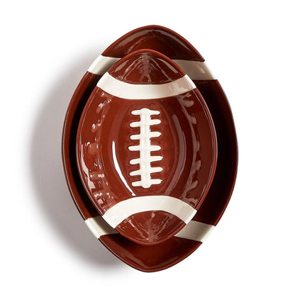 Football Tidbit Bowls—ceramic trays in the shape of a football, brown with white lacing and stripe details. Available in small (8″), medium (12″), and large (16″) sizes.