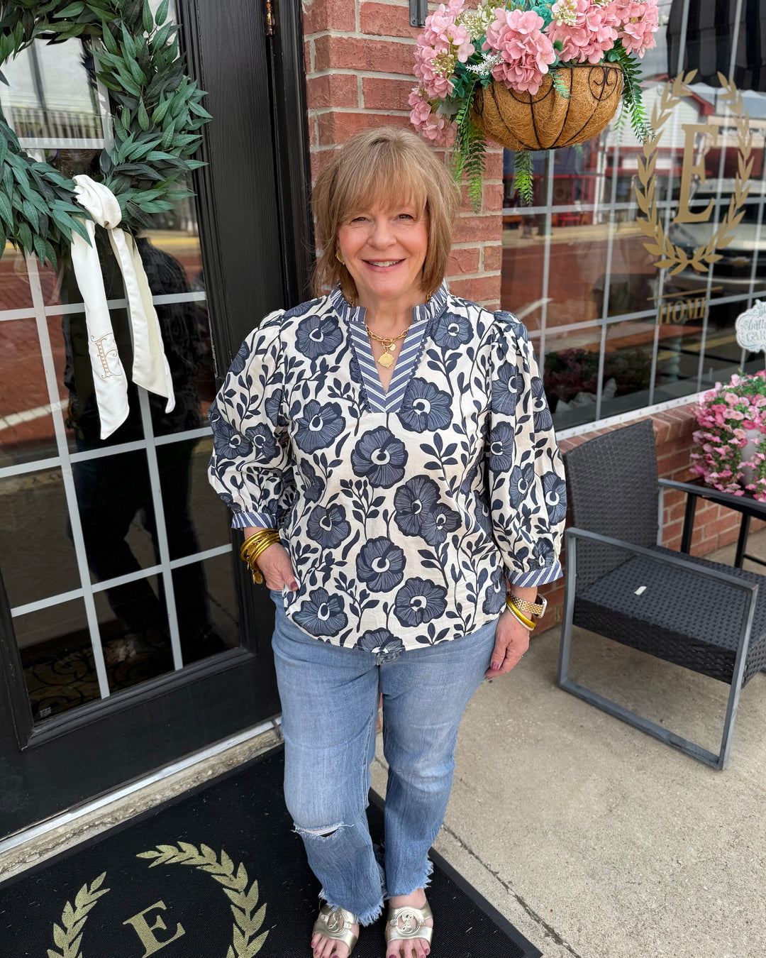 Bonnie Ruffle Floral Blouse with ruffled details, available in sizes XS-XL.