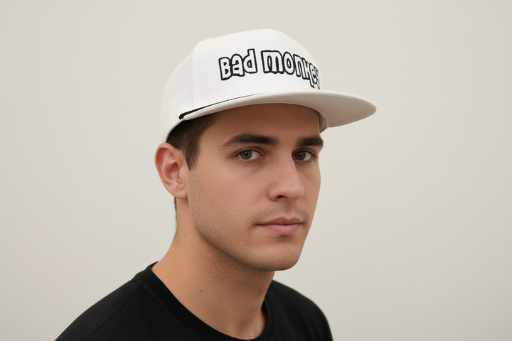 Bad Monkey Hat with black embroidery, adjustable fit. Available in S/M, M/L, and L/XL sizes.